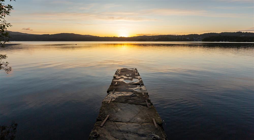 A sunset view of Lake WIndermere from the jetty at Low Strawberry Gardens in Nr Hawkshead, Cumbria
