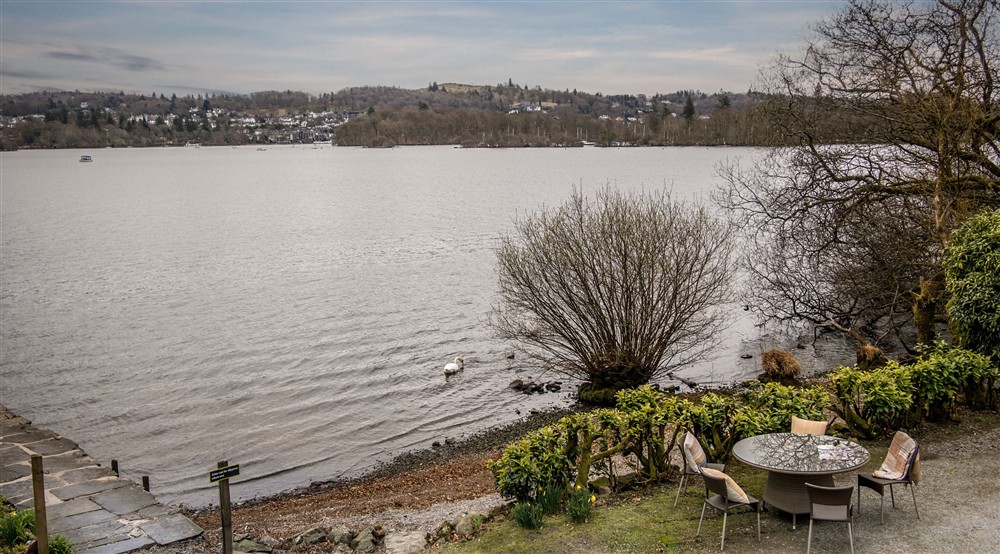 The outdoor seating area by the jetty outside Low Strawberry Gardens, Windermere, Cumbria at Low Strawberry Gardens in Nr Hawkshead, Cumbria