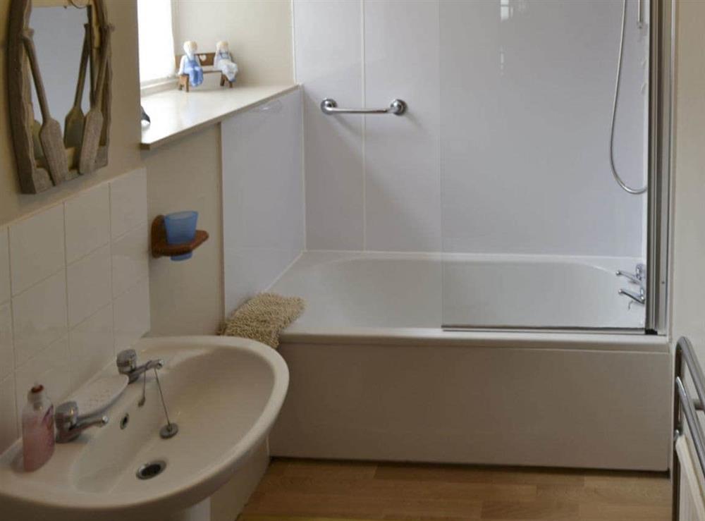 Bathroom with shower over bath at Low Tide in Cellardyke, near Anstruther, Fife