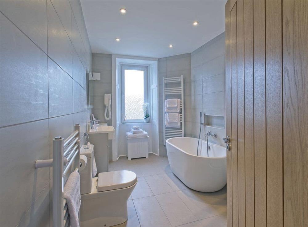 Bathroom with separate shower unit, toilet and basin with storage. In addition, two heated towel rails, heated mirror and a heated tiled floor. at Lower Canterbury House in Gattonside near Melrose, Roxburghshire