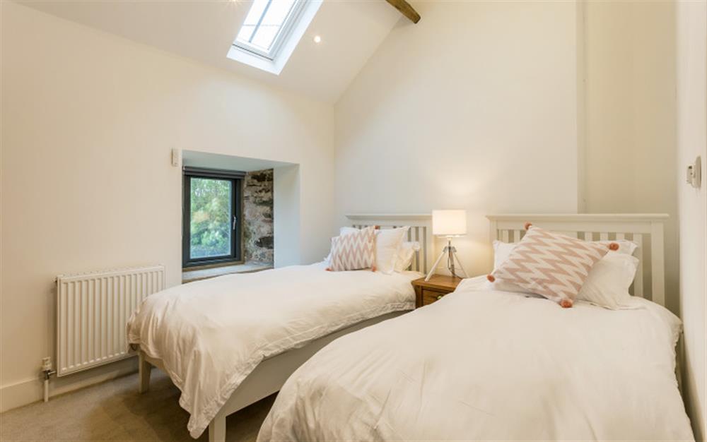 Bedroom 2 with TV and en suite shower room at Lower Court Barn in Hope Cove