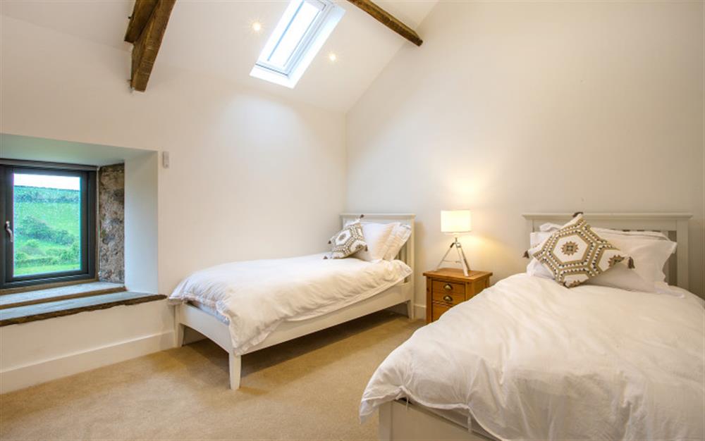 Bedroom 3 with twin beds and TV at Lower Court Barn in Hope Cove