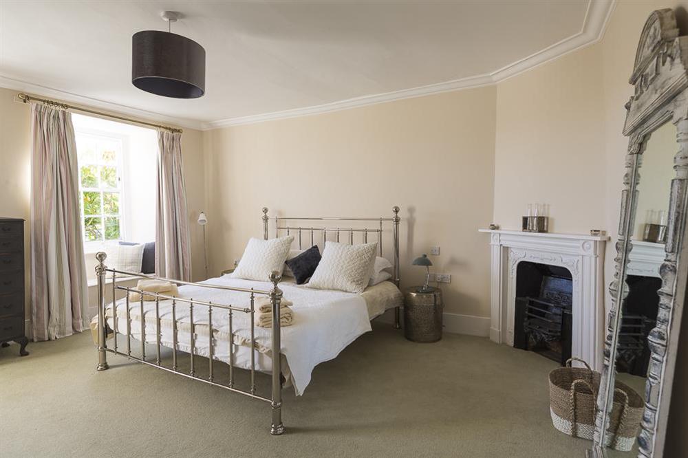 Double bedroom with super-King size bed at Lower Easton Farmhouse in , Nr Salcombe