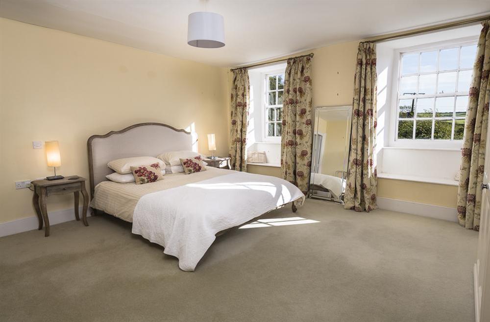En suite master bedroom with super-King size bed at Lower Easton Farmhouse in , Nr Salcombe