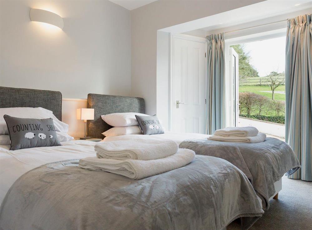 Comfortable twin bedroom at Garden Cottage, 