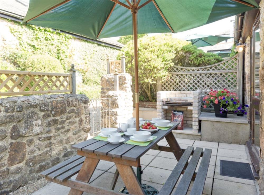 Outdoor furniture and built-in BBQ in rear courtyard