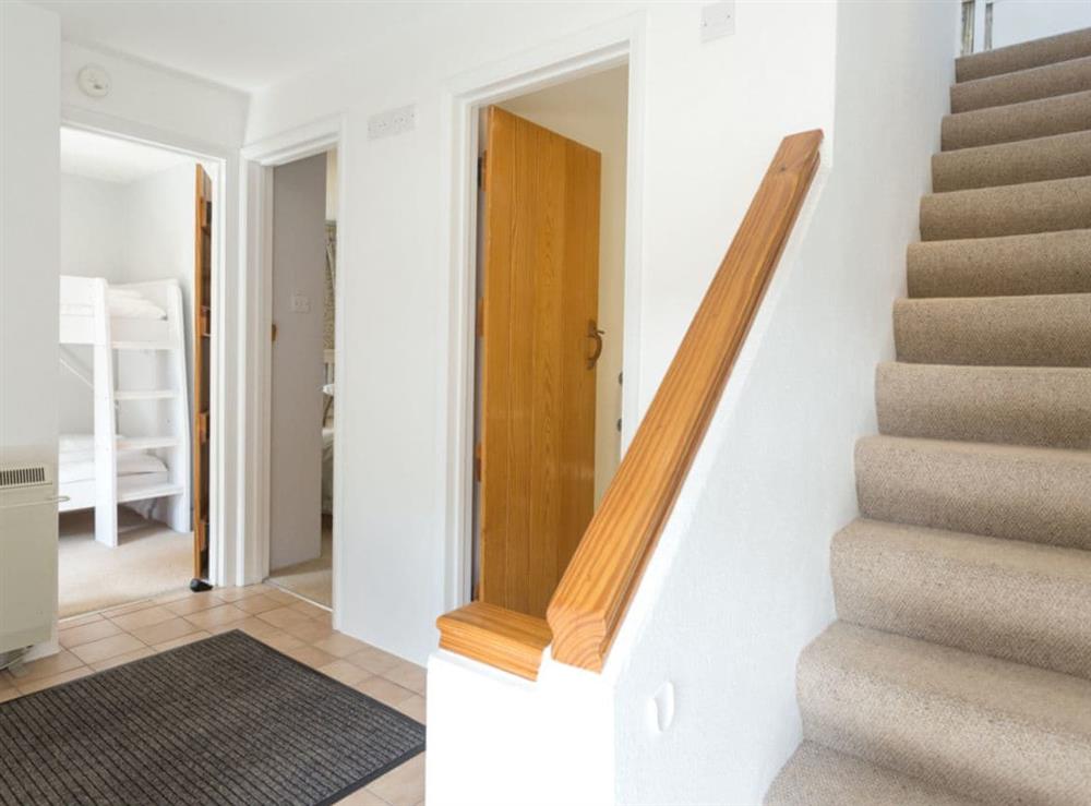Stairs to bedrooms on lower floor at Stable Corner, 