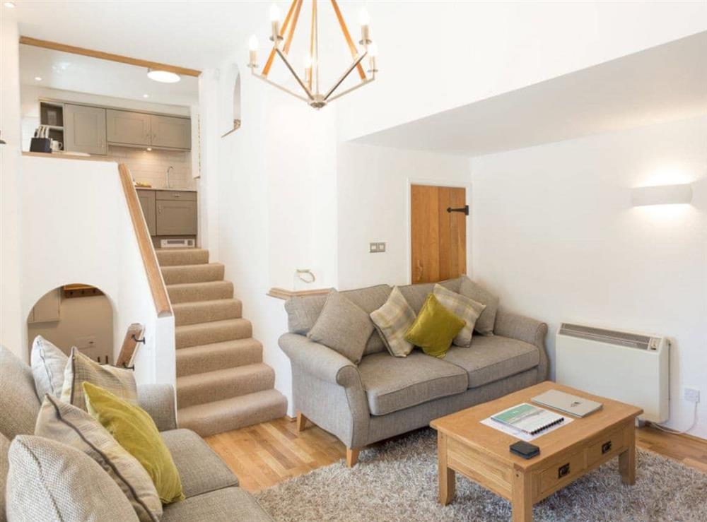 Spacious lounge with stairs to upper and lower levels at Torfield, 