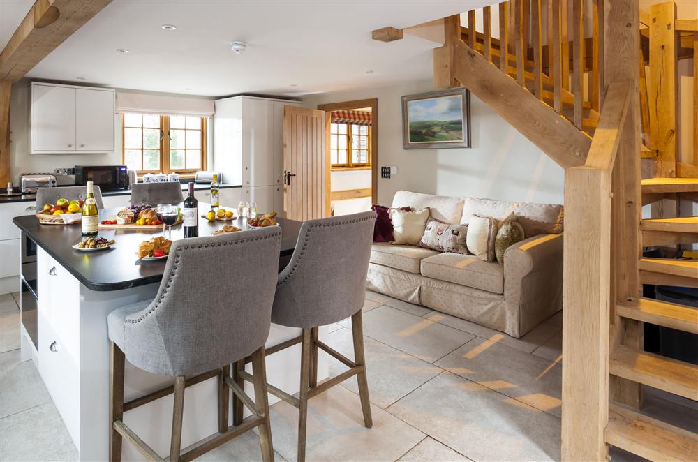 The kitchen leads up to the mezzanine  at Lower Farm Barn, Hungerford
