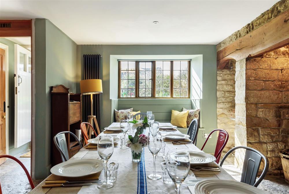 Lower Farm, Dorset: Dining room with seating for all guests and a wood burning stove at Lower Farm, Sherborne
