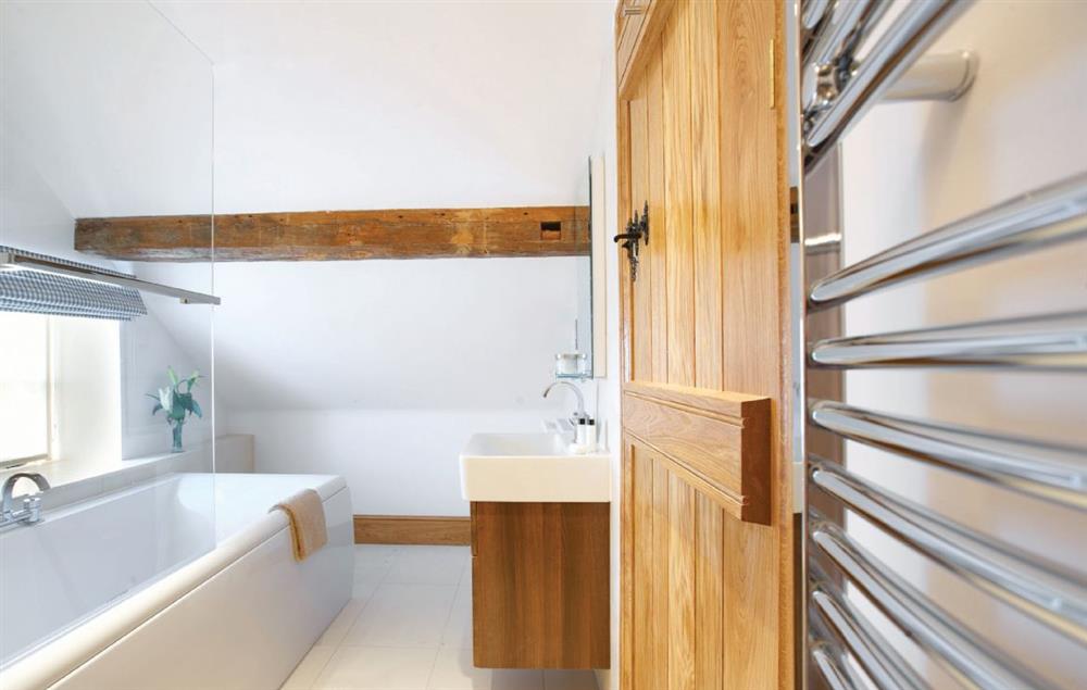 Bathroom with shower over the bath at Lower Farmhouse,  Todenham, Moreton-in-Marsh
