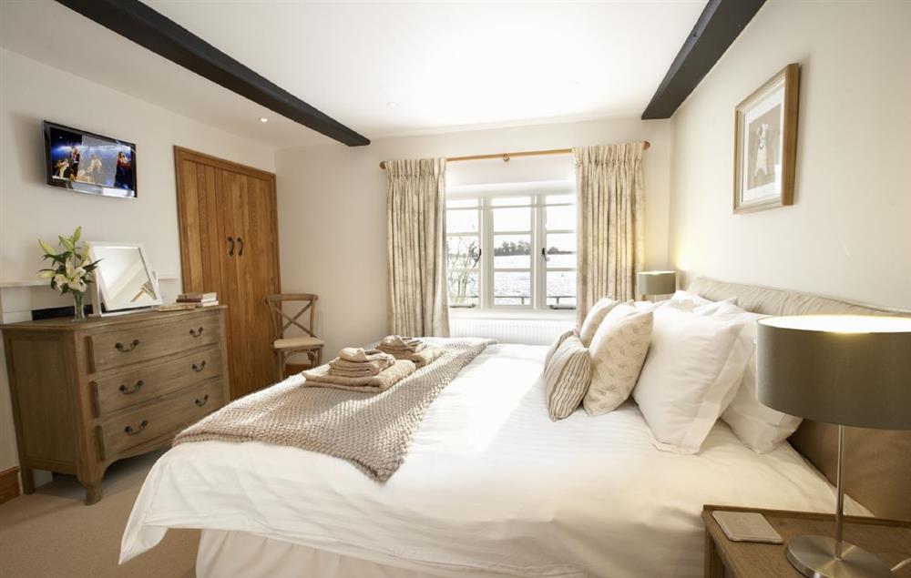 Bedroom three with a 6’ super-king size bed with en-suite shower room at Lower Farmhouse,  Todenham, Moreton-in-Marsh