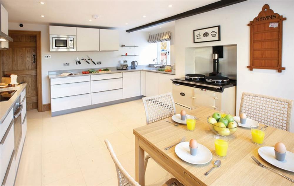 Contemporary breakfast kitchen with Aga and separate electric hob and oven at Lower Farmhouse,  Todenham, Moreton-in-Marsh