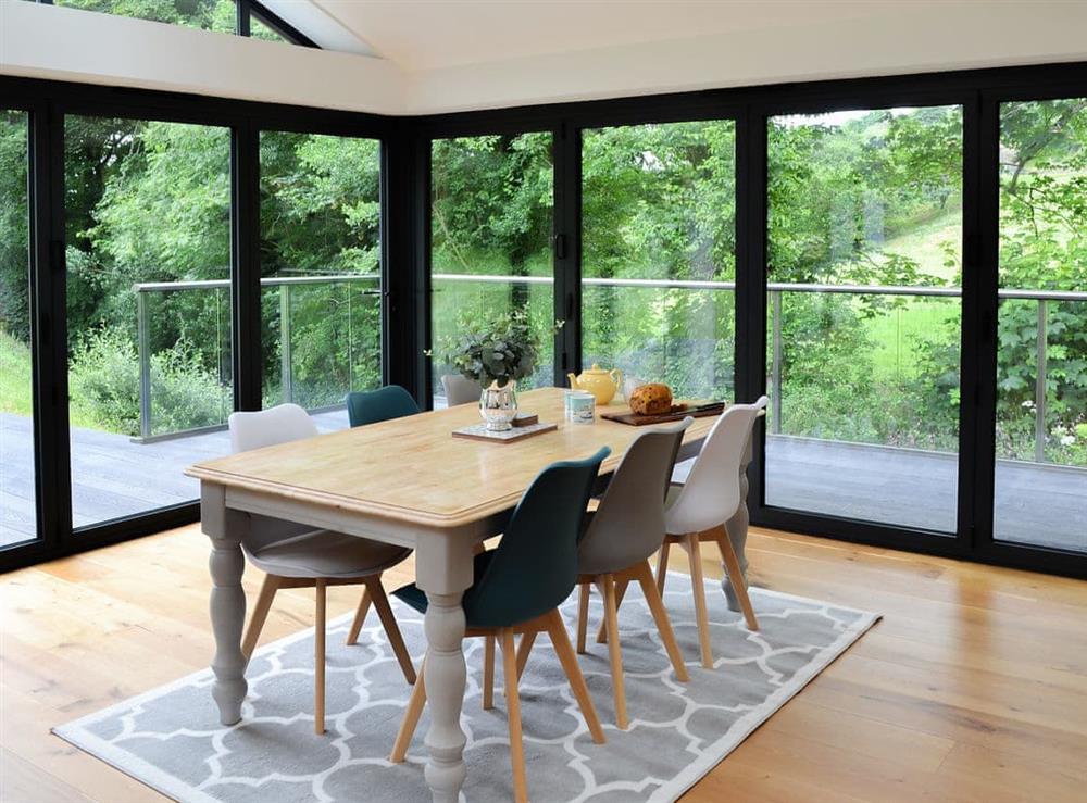 Dining area with wonderful garden views at Lower Helland in Ladock, near Truro, Cornwall