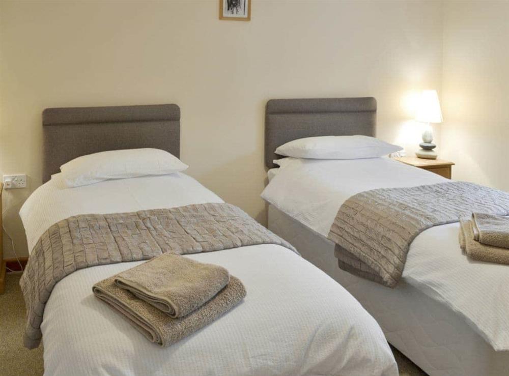 Comfortable twin bedroom at Lower Moon in Port Isaac, Cornwall