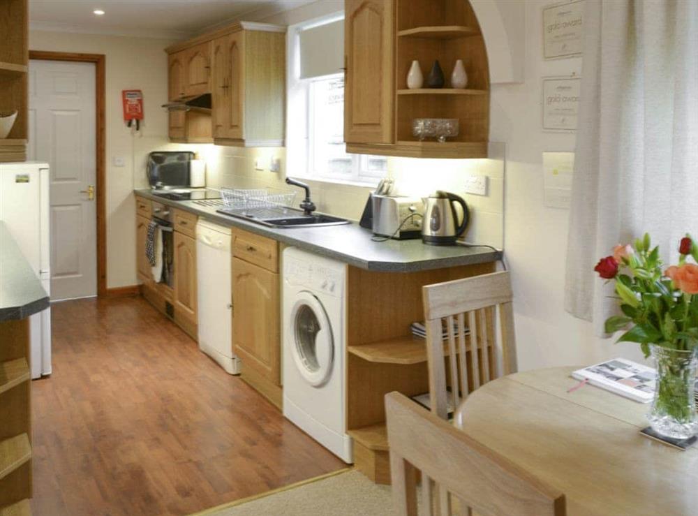 Convenient dining area and well-equipped kitchen at Lower Moon in Port Isaac, Cornwall