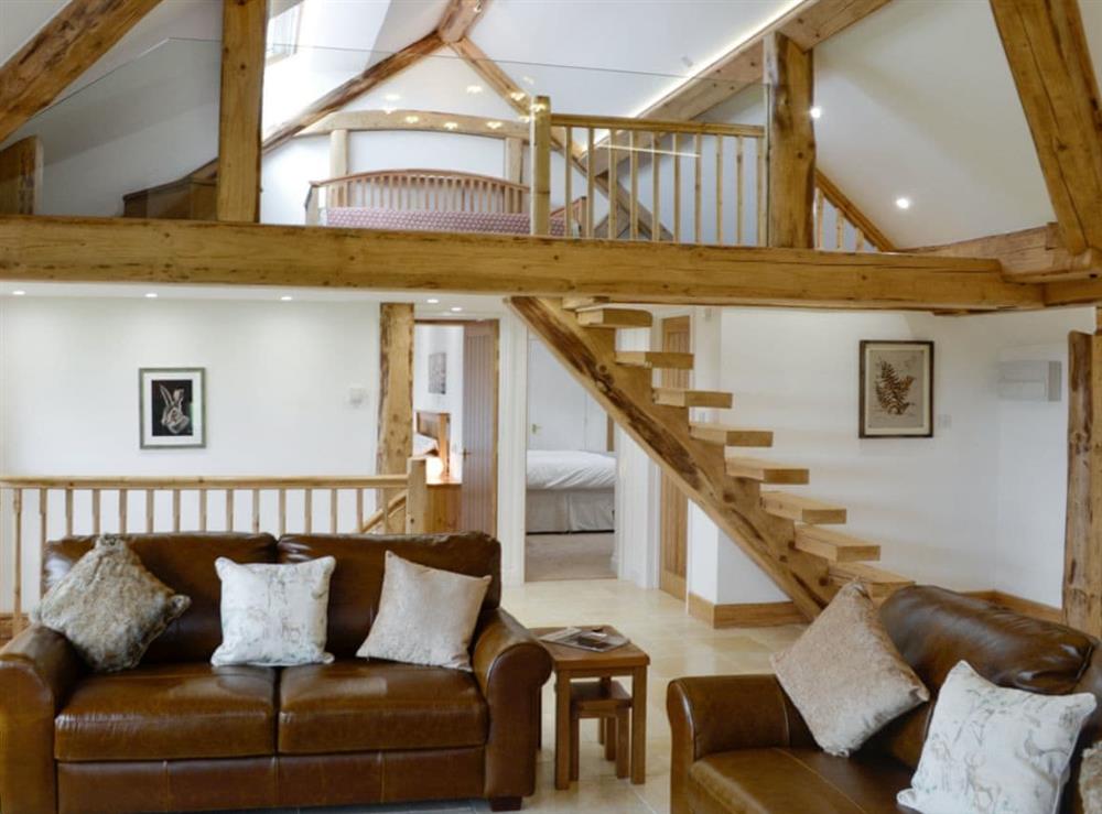 Attractive living area with mezzanine at Combe View, 