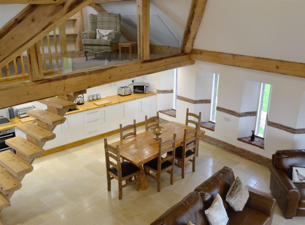 View from the second mezzanine over the open-plan living space at Combe View, 