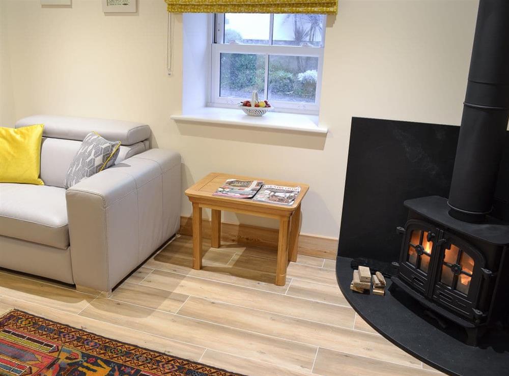 Cosy living room with wood burner (photo 3) at No 2 The Barn, 