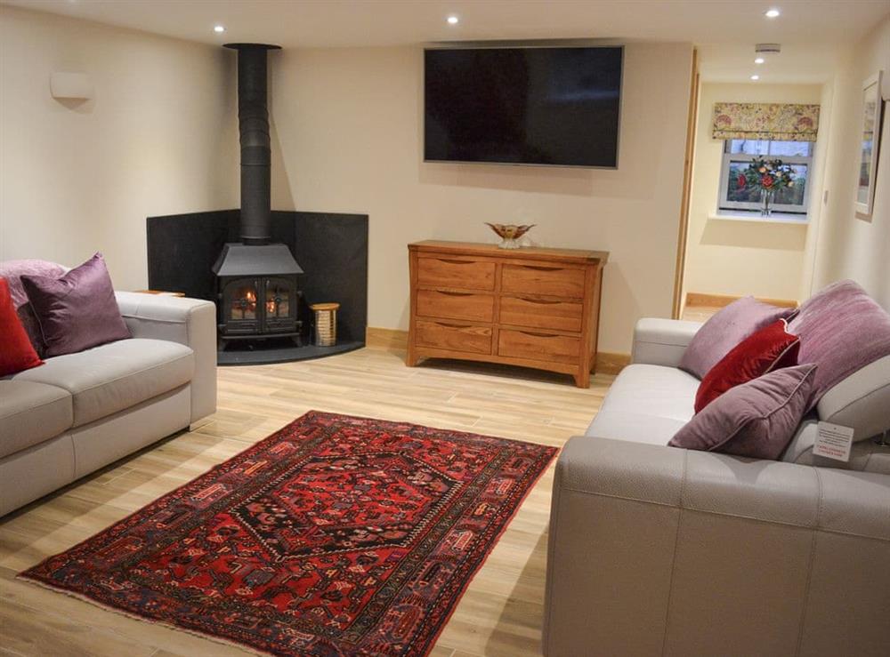 Cosy living room with wood burner at No 3 The Barn, 