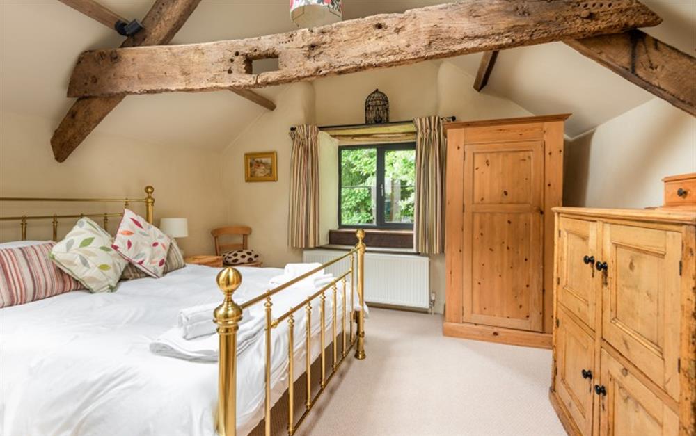 The charming master bedroom  at Lower Well Cottage in Ugborough