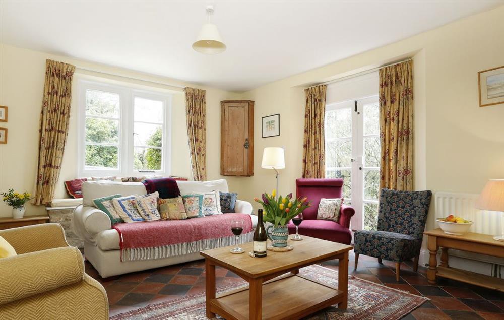 Double aspect windows and cosy sofa to relax in at Lowfields, Sarsden