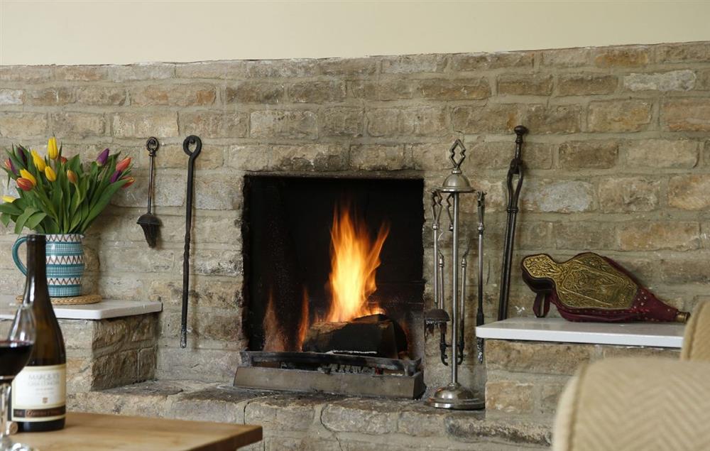 Enjoy a warming open fire on a chilly evening at Lowfields at Lowfields, Sarsden
