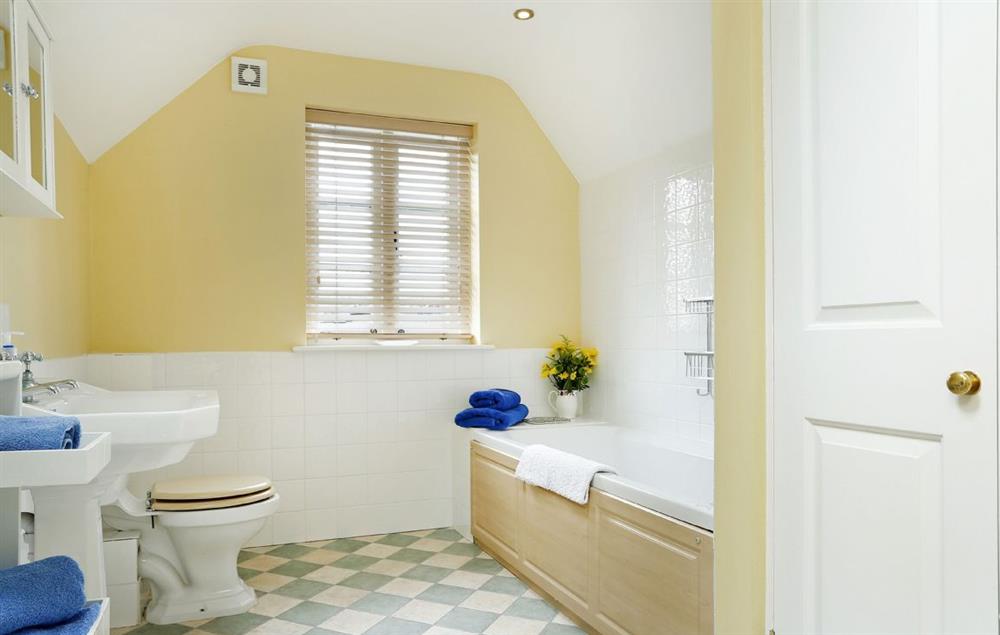 Family bathroom with bath and shower attachment, wc and wash basin at Lowfields, Sarsden