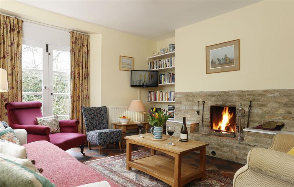 The comfortable sitting room with open fire place at Lowfields, Sarsden