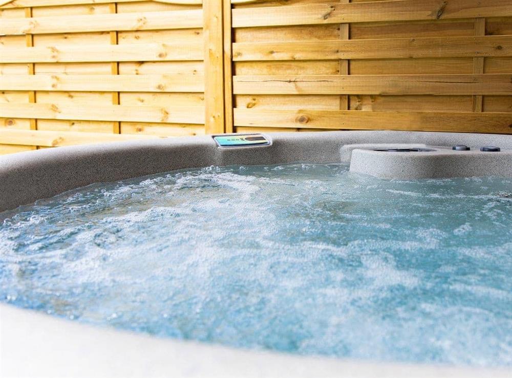 Relaxing hot tub at Luckington Stables 1 in Newbury, near Shepton Mallet, Somerset