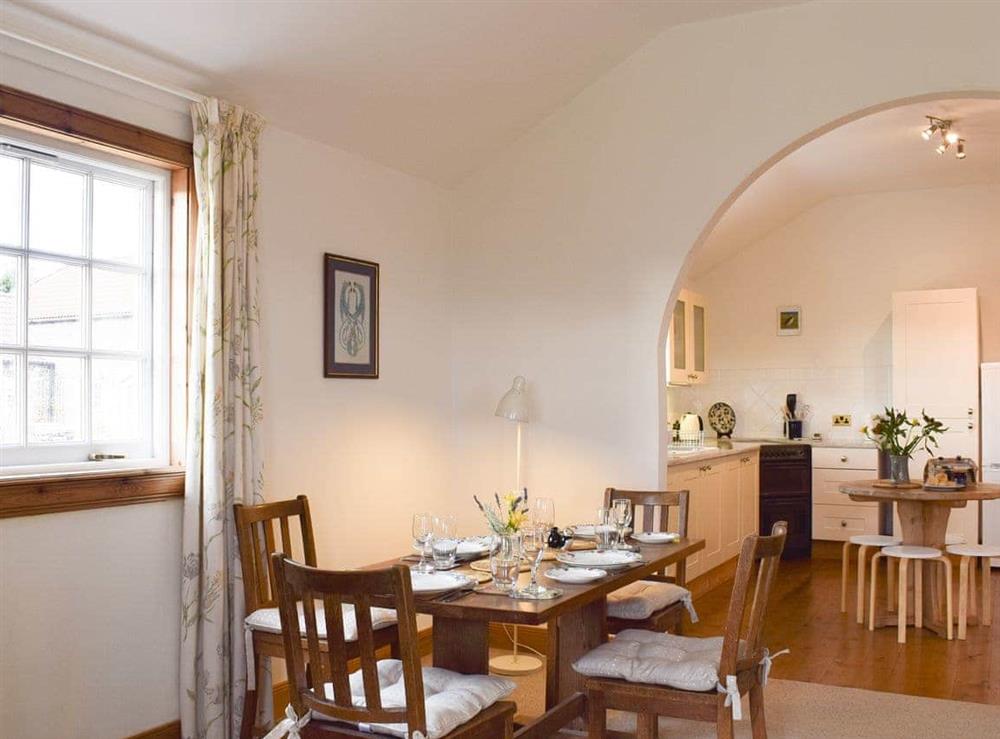 Dining area with open aspect to kitchen/diner at Lucklaw Steading Cottage in Balmullo, near St Andrews, Fife