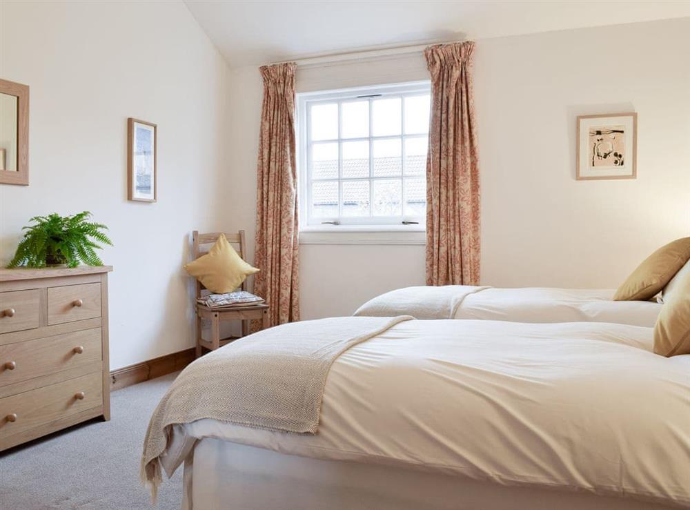 Good-sized twin bedroom at Lucklaw Steading Cottage in Balmullo, near St Andrews, Fife