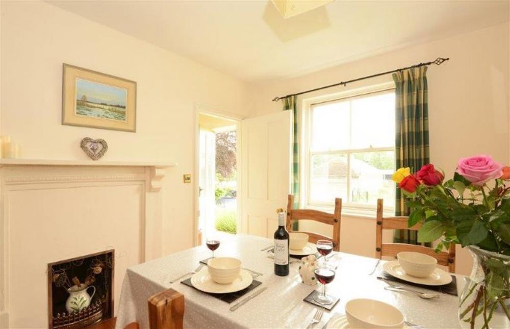 Ground floor: Dining area with feature fireplace at Ludham Hall Cottage, Ludham near Great Yarmouth