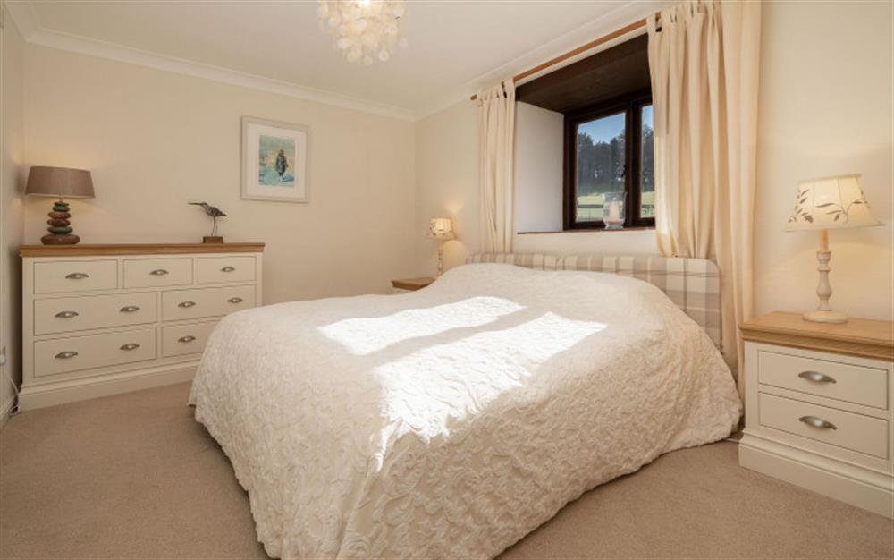 The comfortable bedroom with twin or zip link double bed. at Lupin in Sherford