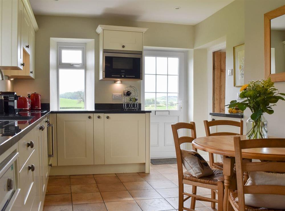 Kitchen/diner at Lupton Hall Cottages in Lupton, near Kirkby Lonsdale, Cumbria