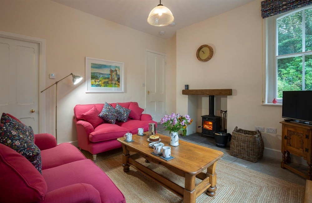 The cosy sitting room in West Lodge, Cheshire at Lyme West Lodge in Macclesfield, Cheshire