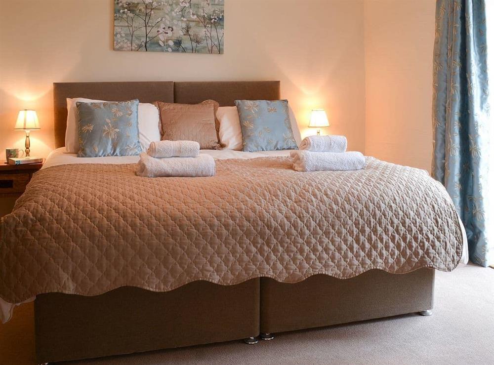 Double bedroom with zip-and-link bed that converts to twin if needed at Lynches in Parkham, near Bideford, Devon
