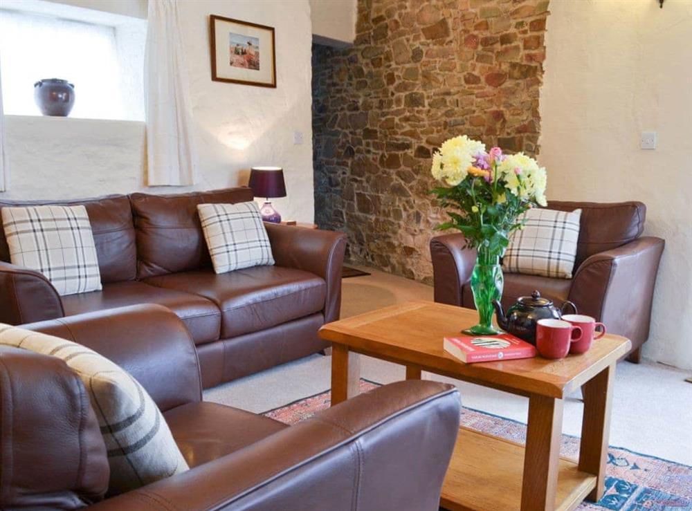 Exposed beams and stonework are a feature throughout the property