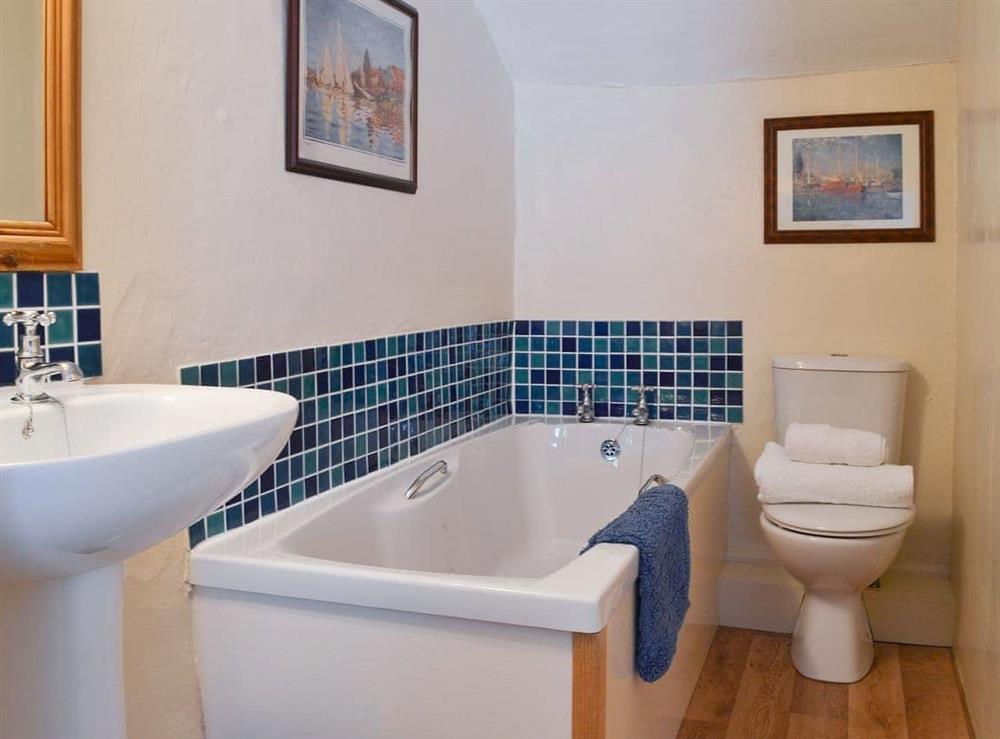 Part-tiled bathroom at Lynches in Parkham, near Bideford, Devon