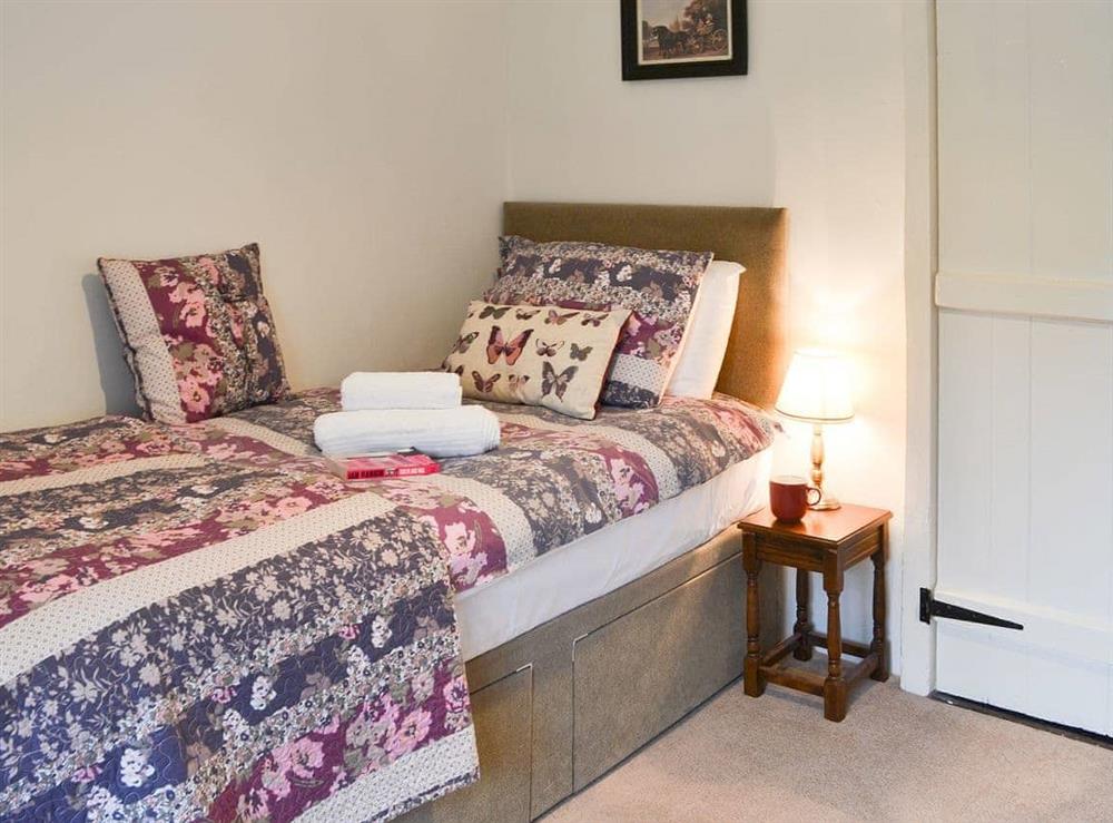 Single bedroom with delightful bedding at Lynches in Parkham, near Bideford, Devon