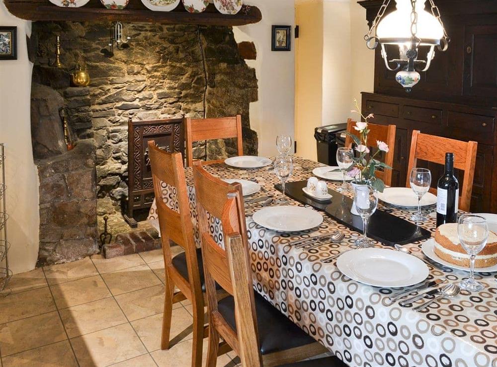 The traditional kitchen/diner has a large Inglenook fireplace at Lynches in Parkham, near Bideford, Devon