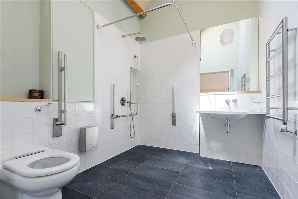 En-suite accessible wet room to bedroom two with WC with support rails at Lynchets, Dorchester