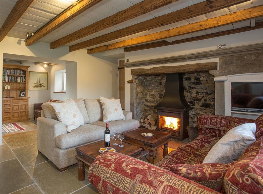 Cosy living room with beamed ceiling at Lyndhurst Cottage in Carlton-in-Coverdale, near Leyburn, North Yorkshire