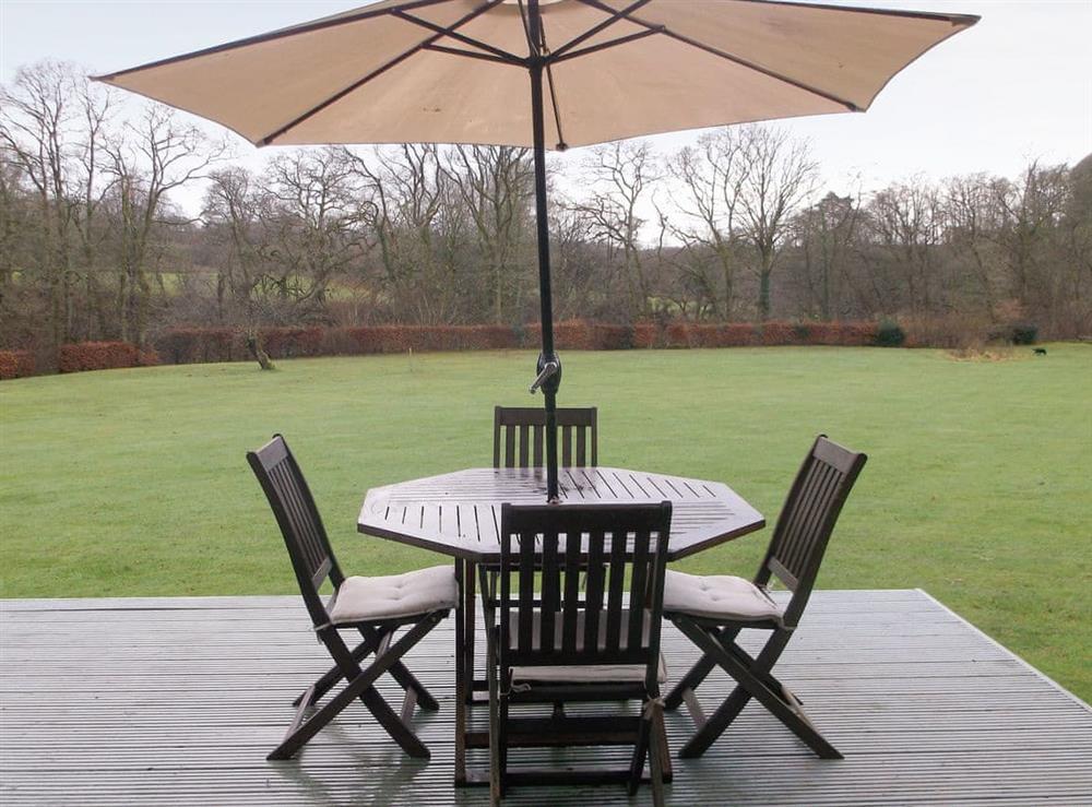 Peaceful rural views from the furnished terrace at Lyne View, Log Cabin in Hethersgill, near Carlisle, Cumbria