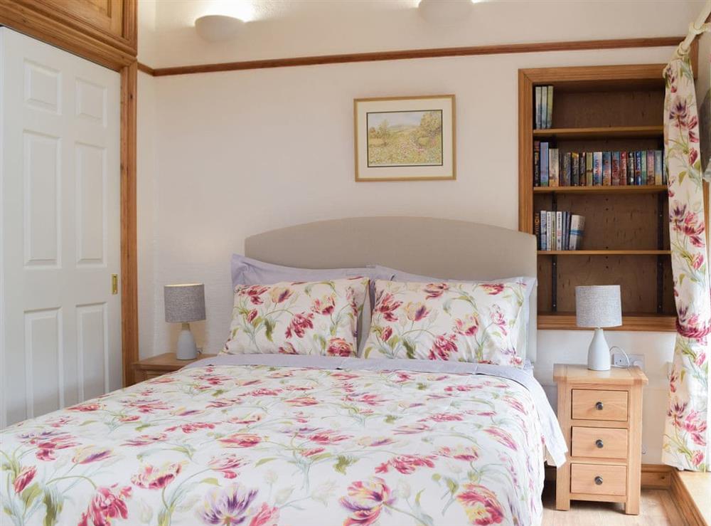 Inviting bedroom with double bed at The Byre, 