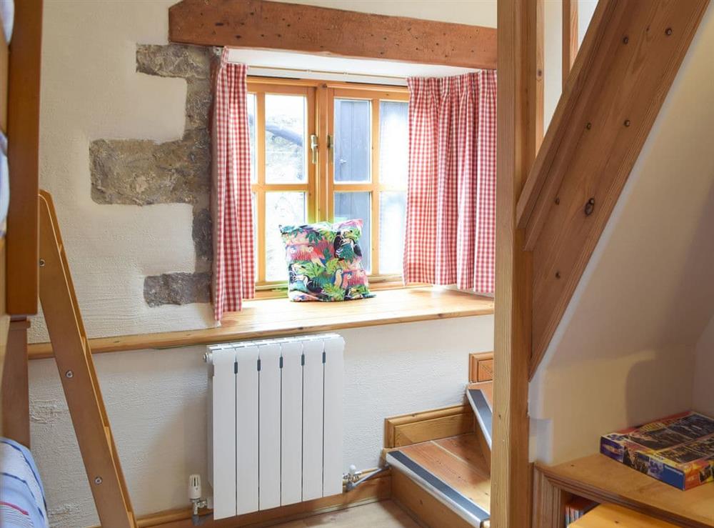 Quaint bedroom with bunk beds at The Byre, 