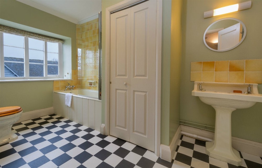First-floor bathroom with shower over bath at Lytes Cary in Somerton, Somerset