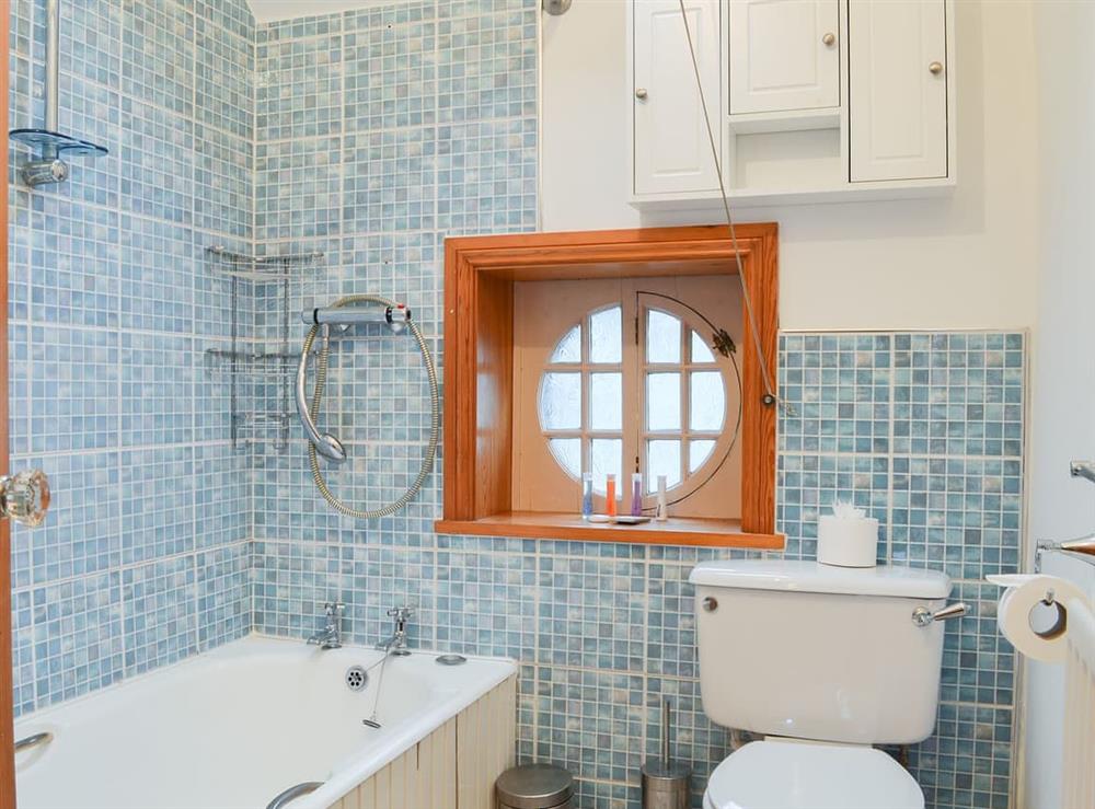 Charming bathroom with shower over the bath at Lythdene in Grange-over-Sands, Cumbria