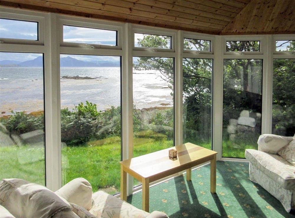 Conservatory with panoramic views at Macinnisfree Cottage in Saasaig, Teangue, Isle of Skye., Great Britain