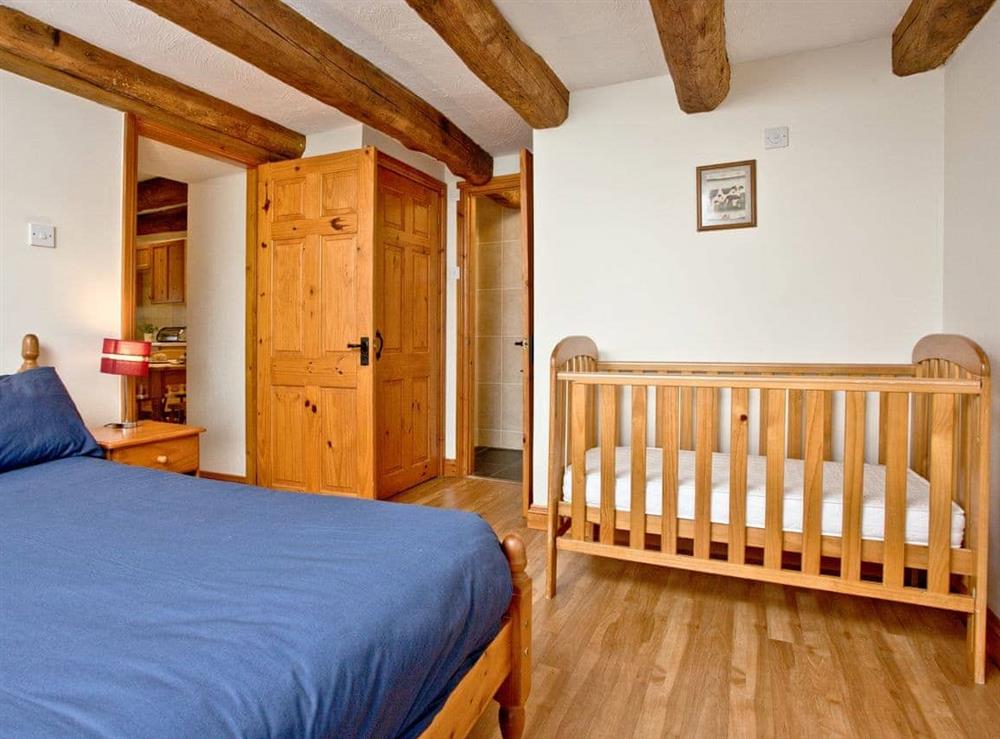 Double bedded room with children’s cot